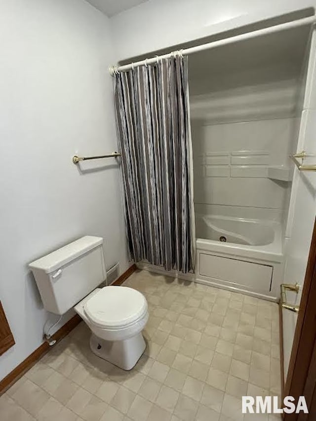 full bathroom with toilet, shower / bath combo with shower curtain, and tile patterned flooring
