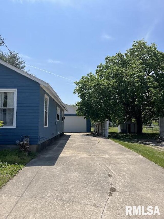 view of side of home with a garage