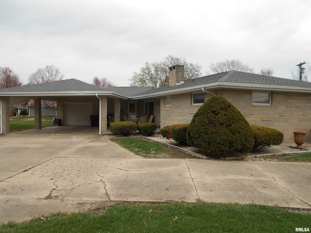 4 Hiel Dr, Bushnell, IL 61422 - view of front of property featuring stone siding, an attached garage, a chimney, a shingled roof, and concrete driveway