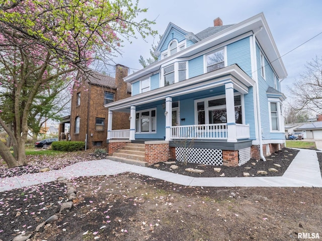 943 NE Glen Oak Ave, Peoria, IL 61603 - view of front of property with a chimney and covered porch