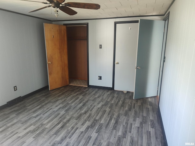 unfurnished bedroom with ornamental molding, ceiling fan, and wood finished floors
