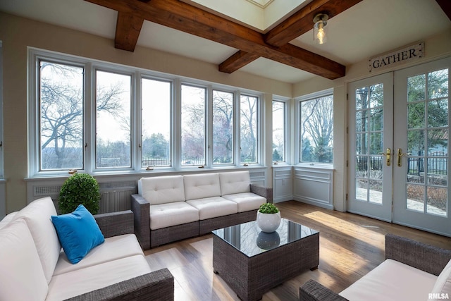 sunroom with french doors, beamed ceiling, and a wealth of natural light