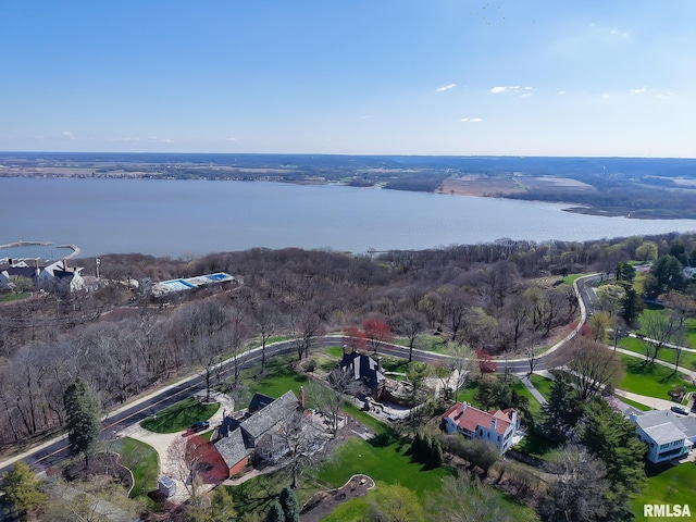 bird's eye view with a water view and a wooded view