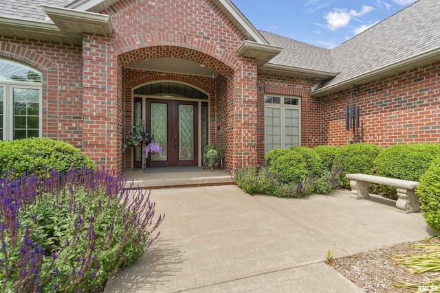 1801 Kern Rd, Washington, IL 61571 - view of exterior entry featuring a shingled roof and brick siding