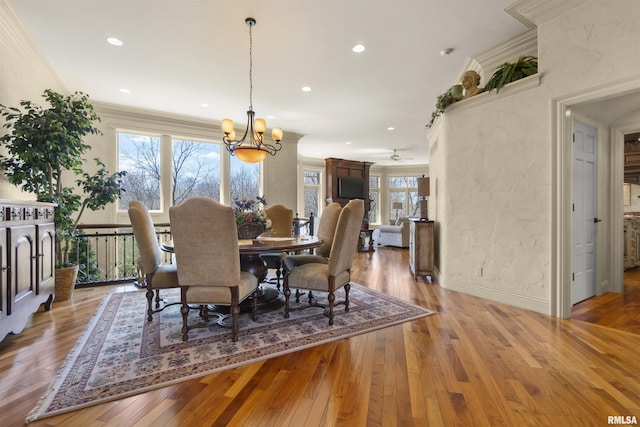 1801 Kern Rd, Washington, IL 61571 - dining space featuring light wood-style floors, a chandelier, ornamental molding, recessed lighting, and baseboards