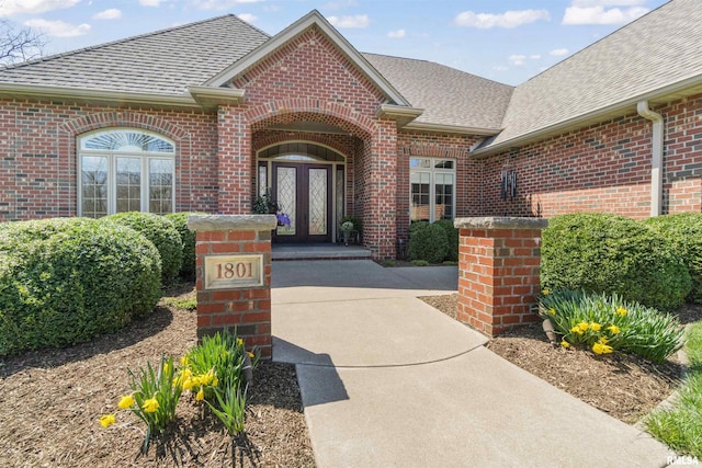 1801 Kern Rd, Washington, IL 61571 - view of exterior entry with french doors, brick siding, and a shingled roof
