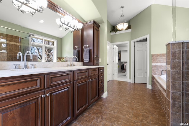1801 Kern Rd, Washington, IL 61571 - bathroom with double vanity, a garden tub, and lofted ceiling
