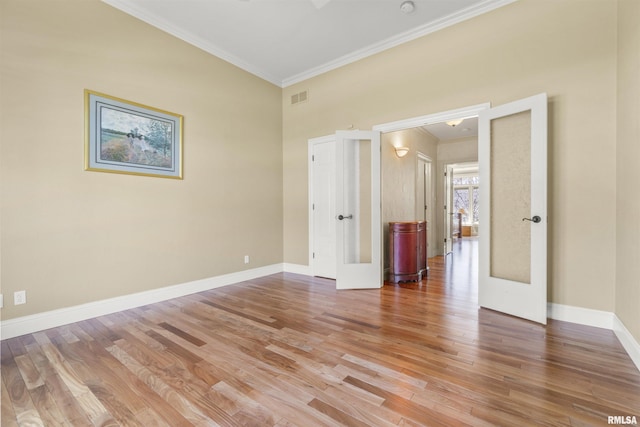 1801 Kern Rd, Washington, IL 61571 - unfurnished room featuring ornamental molding, light wood-style floors, baseboards, and french doors