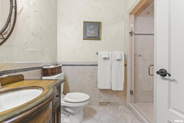 1801 Kern Rd, Washington, IL 61571 - full bath with vanity, a stall shower, tile walls, toilet, and a wainscoted wall