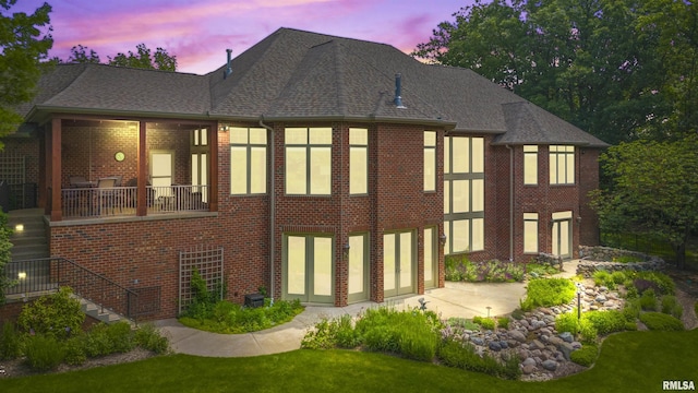 1801 Kern Rd, Washington, IL 61571 - back of property featuring brick siding, stairs, a patio, and roof with shingles