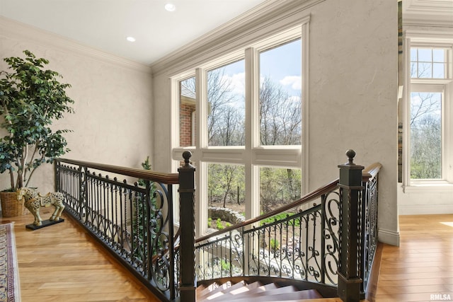 1801 Kern Rd, Washington, IL 61571 - stairway featuring hardwood / wood-style flooring, a textured wall, baseboards, and crown molding