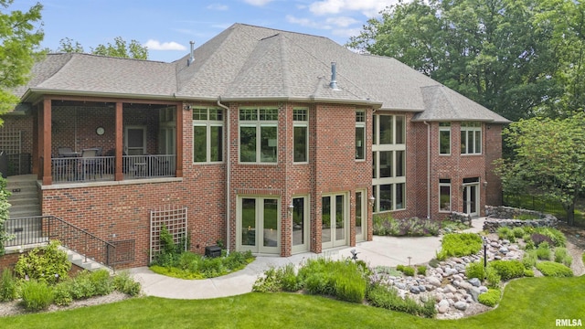 1801 Kern Rd, Washington, IL 61571 - back of property featuring brick siding, a patio, a yard, and stairway