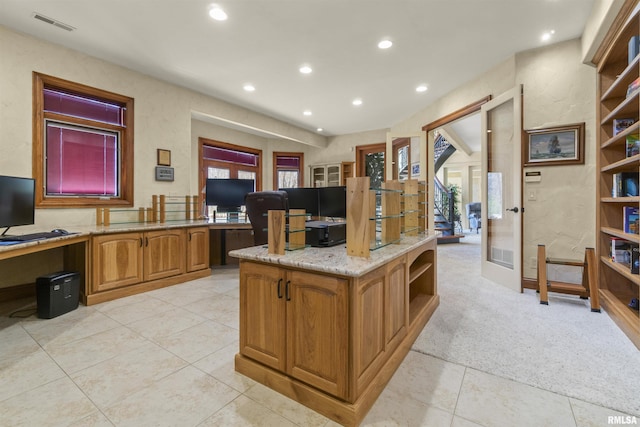 1801 Kern Rd, Washington, IL 61571 - kitchen with open shelves, recessed lighting, light tile patterned flooring, brown cabinetry, and light stone counters