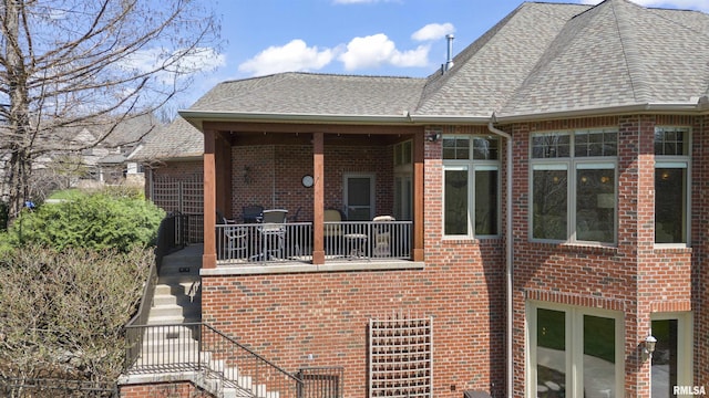1801 Kern Rd, Washington, IL 61571 - view of side of home with brick siding, stairs, and roof with shingles