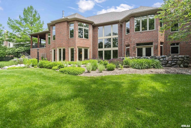 1801 Kern Rd, Washington, IL 61571 - rear view of property featuring a lawn and brick siding