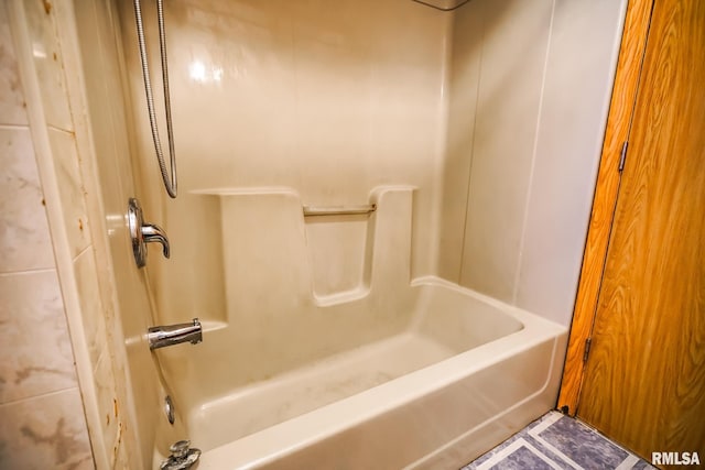 full bath featuring shower / bathtub combination