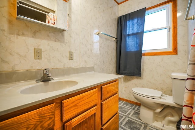 full bath featuring toilet and vanity