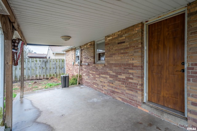 view of patio / terrace featuring fence