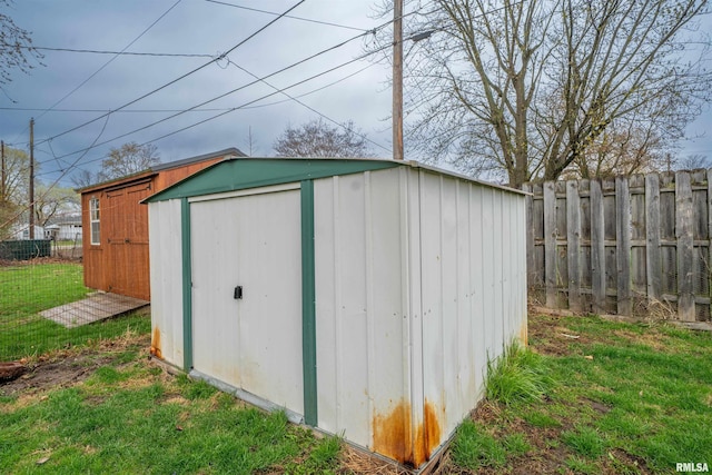view of shed featuring a fenced backyard