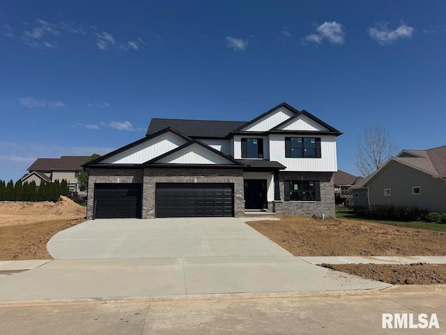 craftsman house with concrete driveway and an attached garage