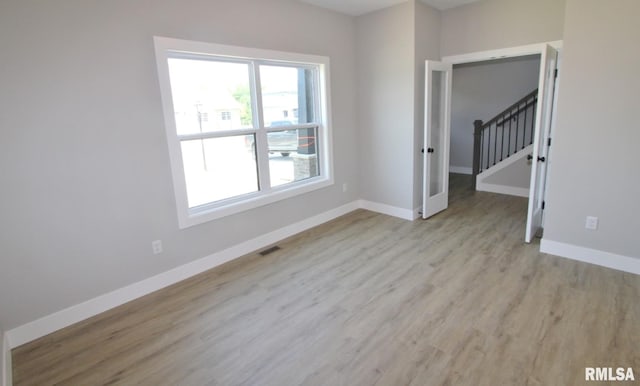 106 Samuel Ct, Washington, IL 61571 - spare room featuring light wood-style flooring and baseboards