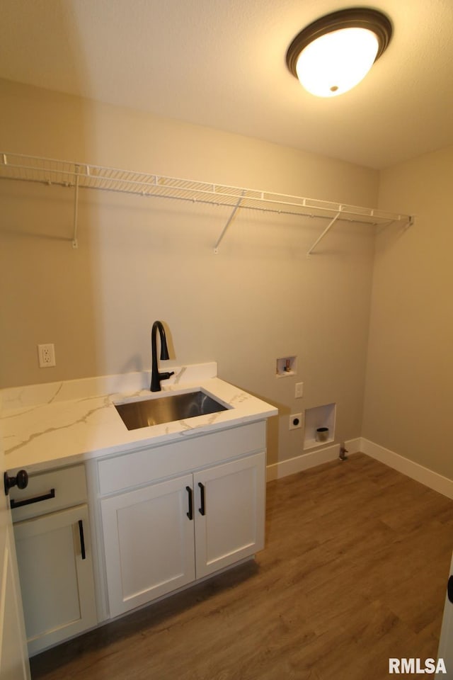 106 Samuel Ct, Washington, IL 61571 - laundry area with hookup for a washing machine, electric dryer hookup, dark wood-style floors, baseboards, and cabinet space