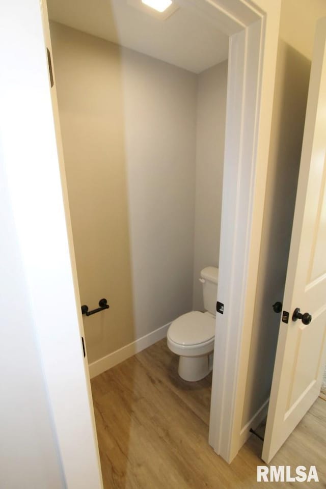 106 Samuel Ct, Washington, IL 61571 - bathroom featuring wood finished floors, toilet, and baseboards