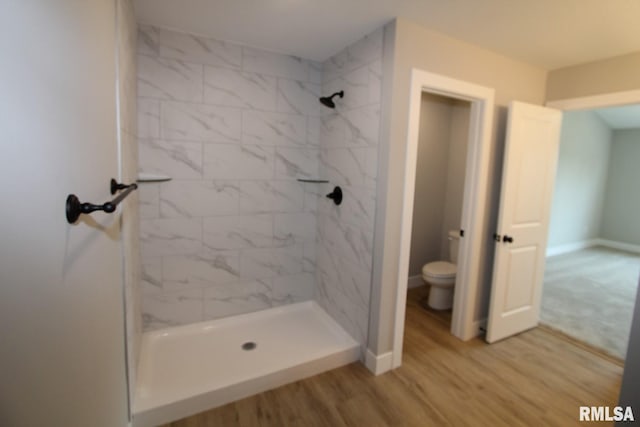 106 Samuel Ct, Washington, IL 61571 - full bath featuring toilet, wood finished floors, a stall shower, and baseboards