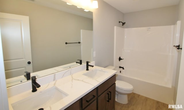 106 Samuel Ct, Washington, IL 61571 - bathroom with toilet, wood finished floors, double vanity, and bathing tub / shower combination