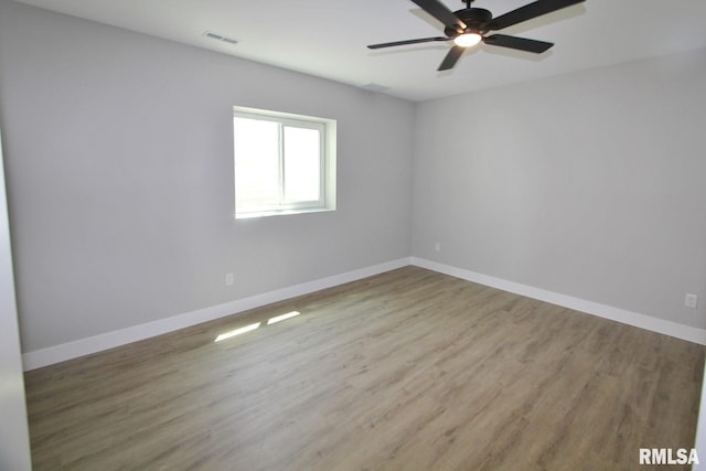 106 Samuel Ct, Washington, IL 61571 - empty room featuring a ceiling fan, wood finished floors, and baseboards