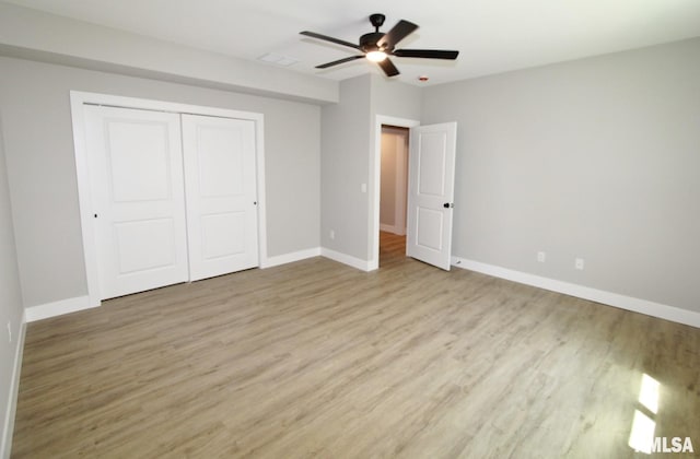 106 Samuel Ct, Washington, IL 61571 - unfurnished bedroom featuring light wood finished floors, baseboards, a closet, and ceiling fan