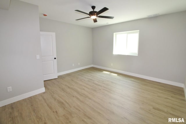 106 Samuel Ct, Washington, IL 61571 - spare room featuring ceiling fan, baseboards, and light wood-type flooring
