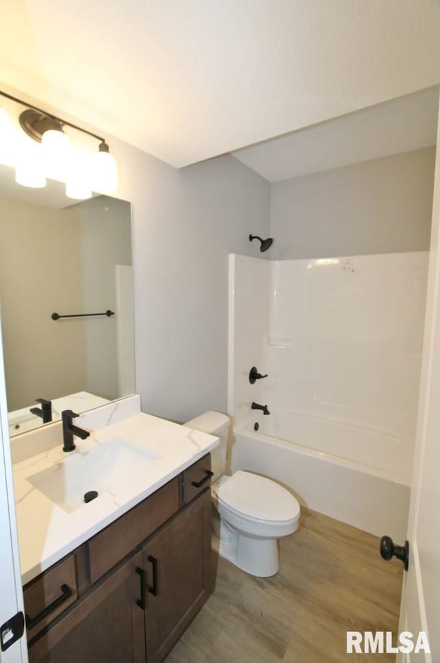 106 Samuel Ct, Washington, IL 61571 - bathroom featuring vanity, wood finished floors, toilet, and bathtub / shower combination
