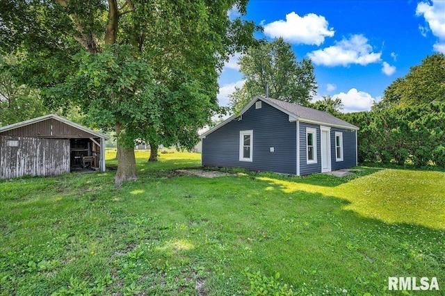 420 S Western Ave, Abingdon, IL 61410 - view of green lawn with a pole building and an outdoor structure