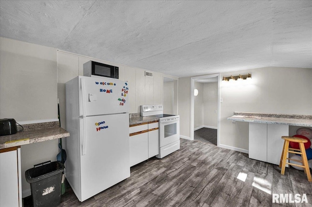 420 S Western Ave, Abingdon, IL 61410 - kitchen featuring white appliances, dark wood-style floors, a textured ceiling, and white cabinets