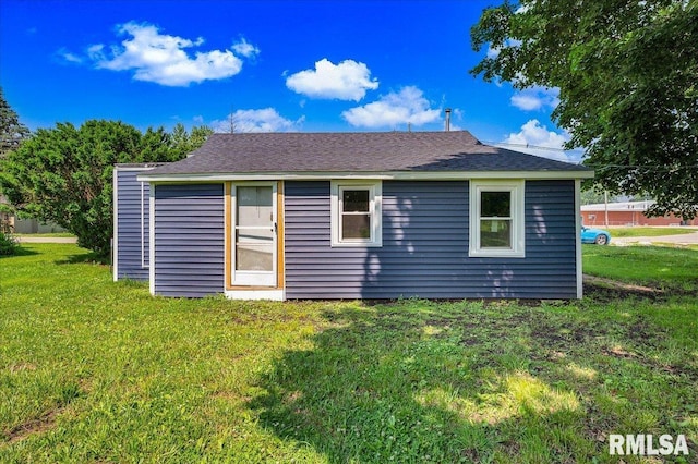 420 S Western Ave, Abingdon, IL 61410 - back of house with a lawn and roof with shingles