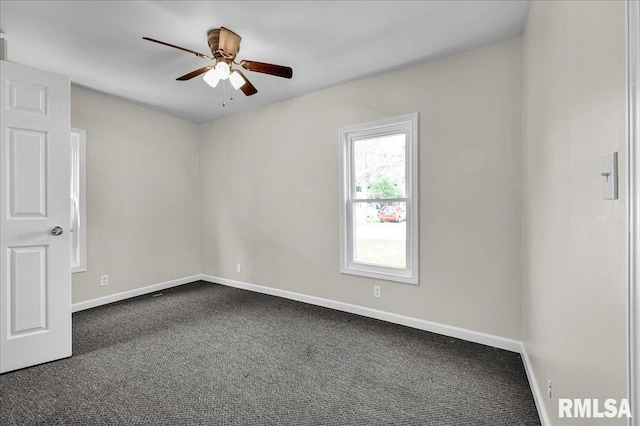 420 S Western Ave, Abingdon, IL 61410 - empty room featuring ceiling fan, dark colored carpet, and baseboards