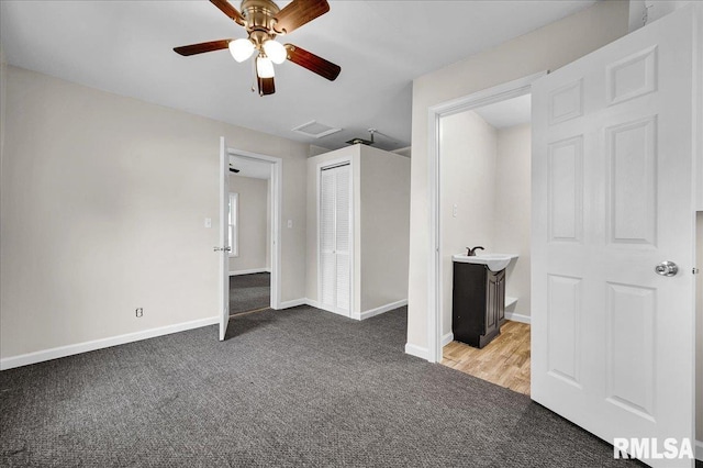 420 S Western Ave, Abingdon, IL 61410 - unfurnished bedroom featuring light carpet, baseboards, a closet, and ceiling fan