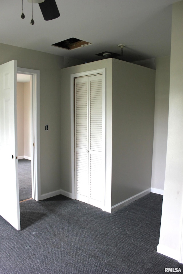 420 S Western Ave, Abingdon, IL 61410 - unfurnished bedroom with dark carpet, a closet, ceiling fan, and baseboards