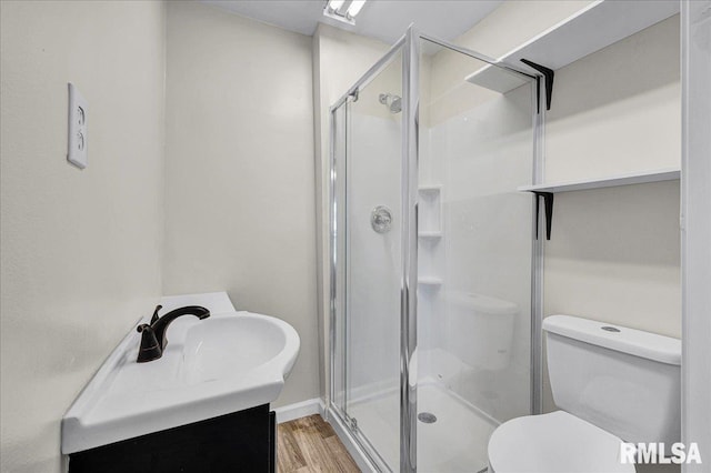 420 S Western Ave, Abingdon, IL 61410 - bathroom featuring wood finished floors, toilet, a shower stall, and vanity