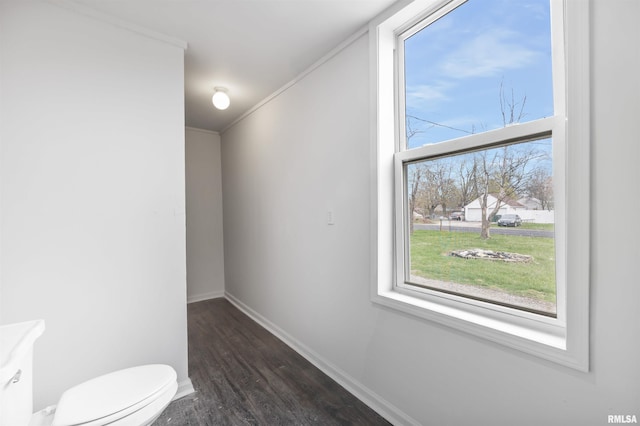 2330 S Airport Rd, Bartonville, IL 61607 - bathroom featuring baseboards, toilet, crown molding, vanity, and wood finished floors