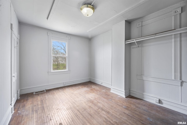 2330 S Airport Rd, Bartonville, IL 61607 - unfurnished bedroom with visible vents and wood-type flooring