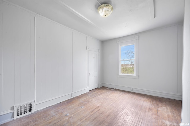 2330 S Airport Rd, Bartonville, IL 61607 - unfurnished room with visible vents and hardwood / wood-style floors