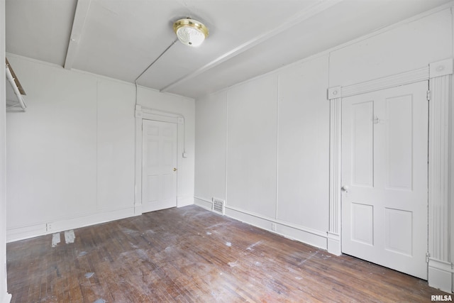 2330 S Airport Rd, Bartonville, IL 61607 - spare room with a decorative wall, visible vents, and hardwood / wood-style floors