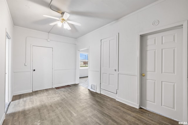 2330 S Airport Rd, Bartonville, IL 61607 - unfurnished bedroom with visible vents, ceiling fan, ornamental molding, and wood finished floors