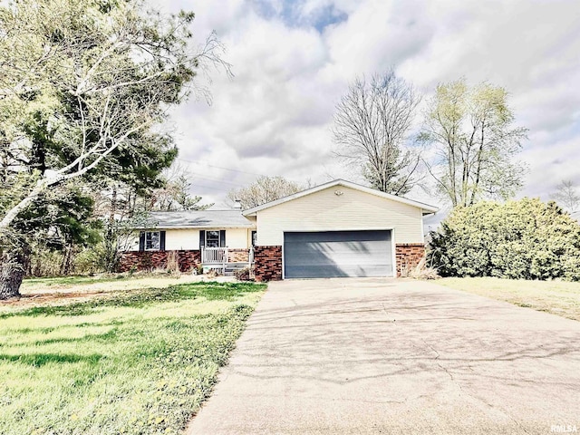 ranch-style home with brick siding, an attached garage, a front lawn, and concrete driveway