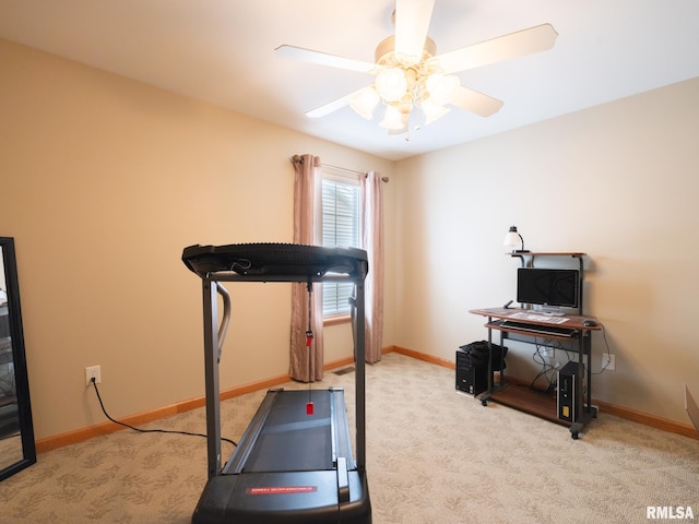 workout room with ceiling fan, baseboards, and carpet