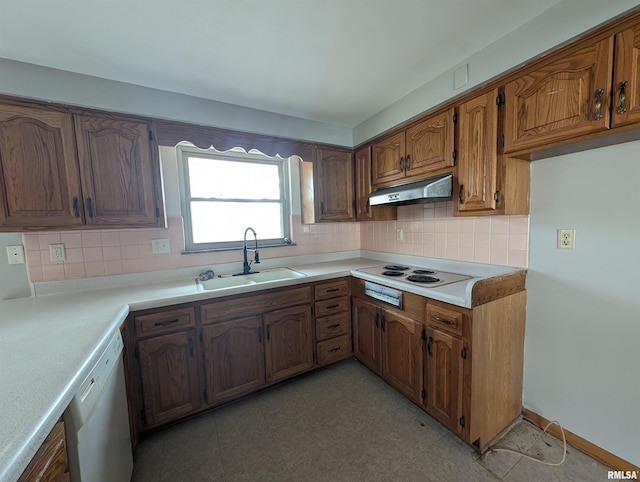 3720 Saint Michael Ave, Peoria, IL 61615 - kitchen with white appliances, tasteful backsplash, under cabinet range hood, light countertops, and a sink