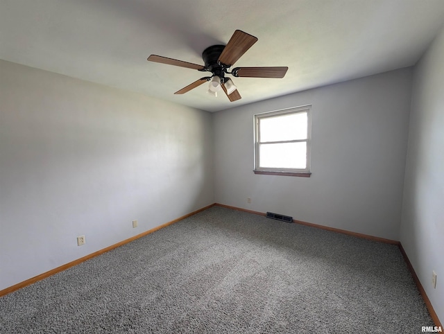 3720 Saint Michael Ave, Peoria, IL 61615 - unfurnished room with carpet flooring, baseboards, a ceiling fan, and visible vents