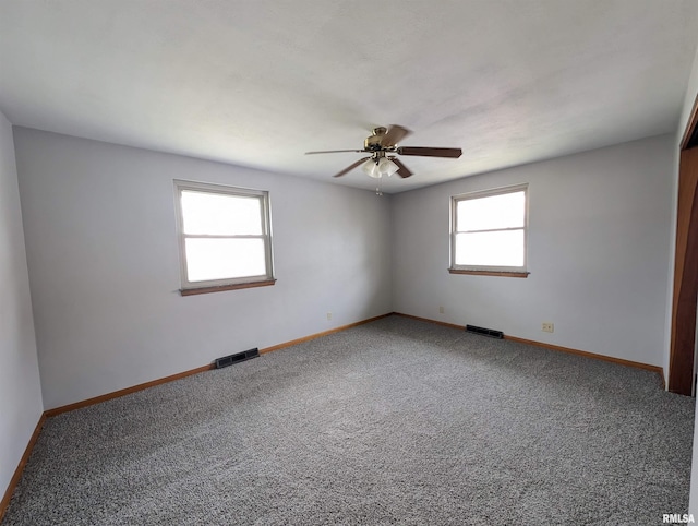 3720 Saint Michael Ave, Peoria, IL 61615 - carpeted spare room with visible vents, baseboards, and a ceiling fan
